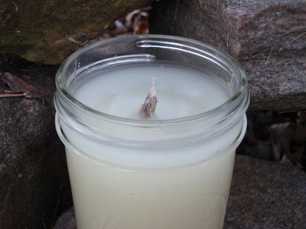 a homemade candle with a cotton wick