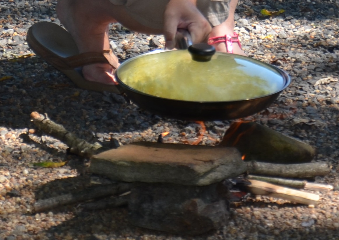 resting a skillet on a rock