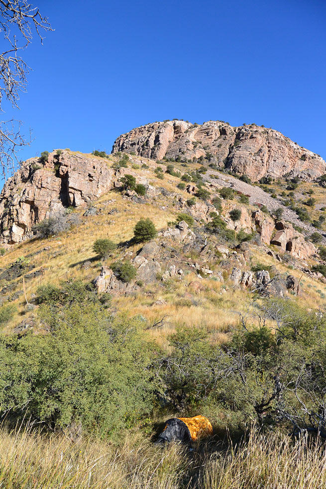 A campsite against a hilly landscape