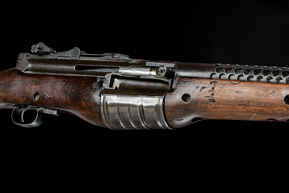 close up of 1941 johnson automatic service rifle rotary magazine