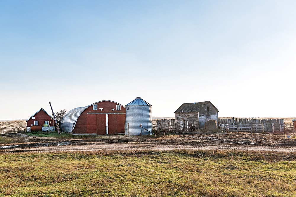 red farm house and barn