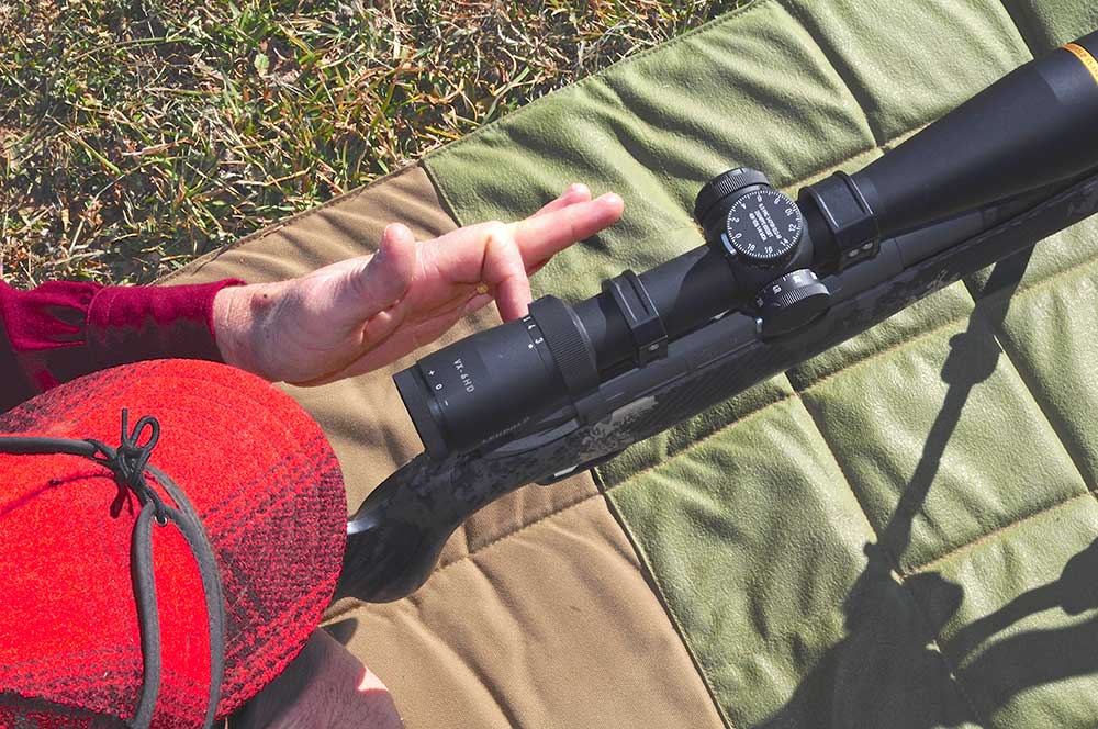 top view of man aiming a long range rifle