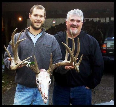 bob decker poses with deer skull and antlers