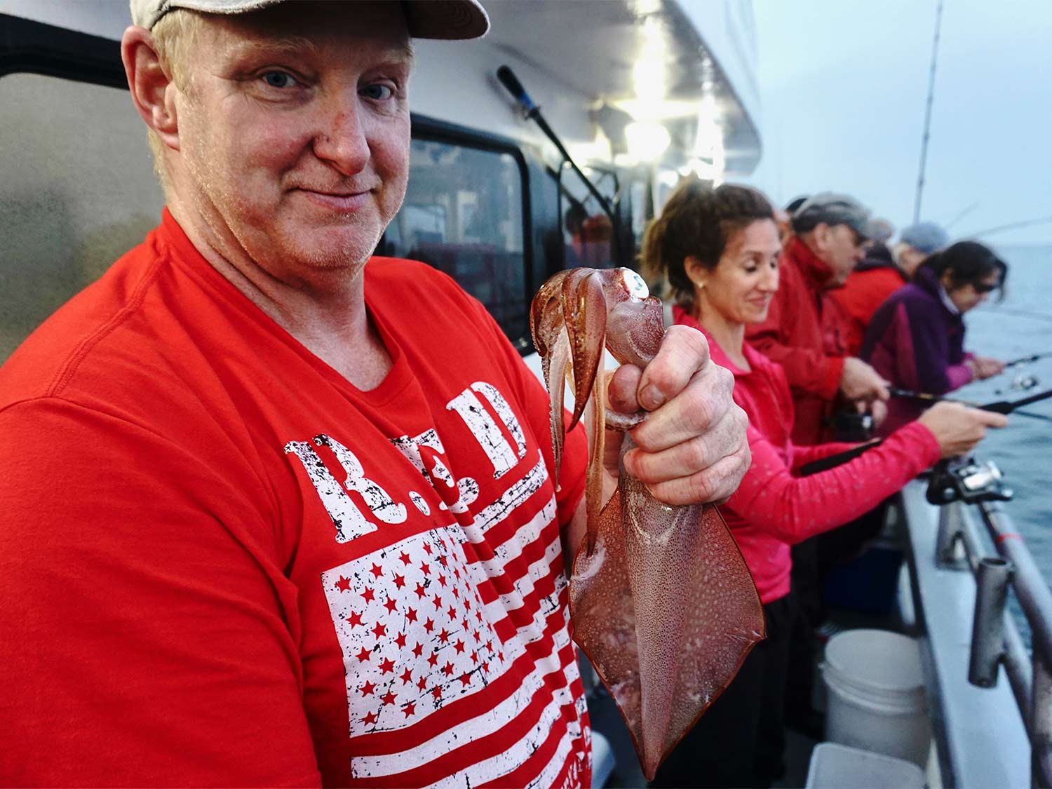 man holding squid