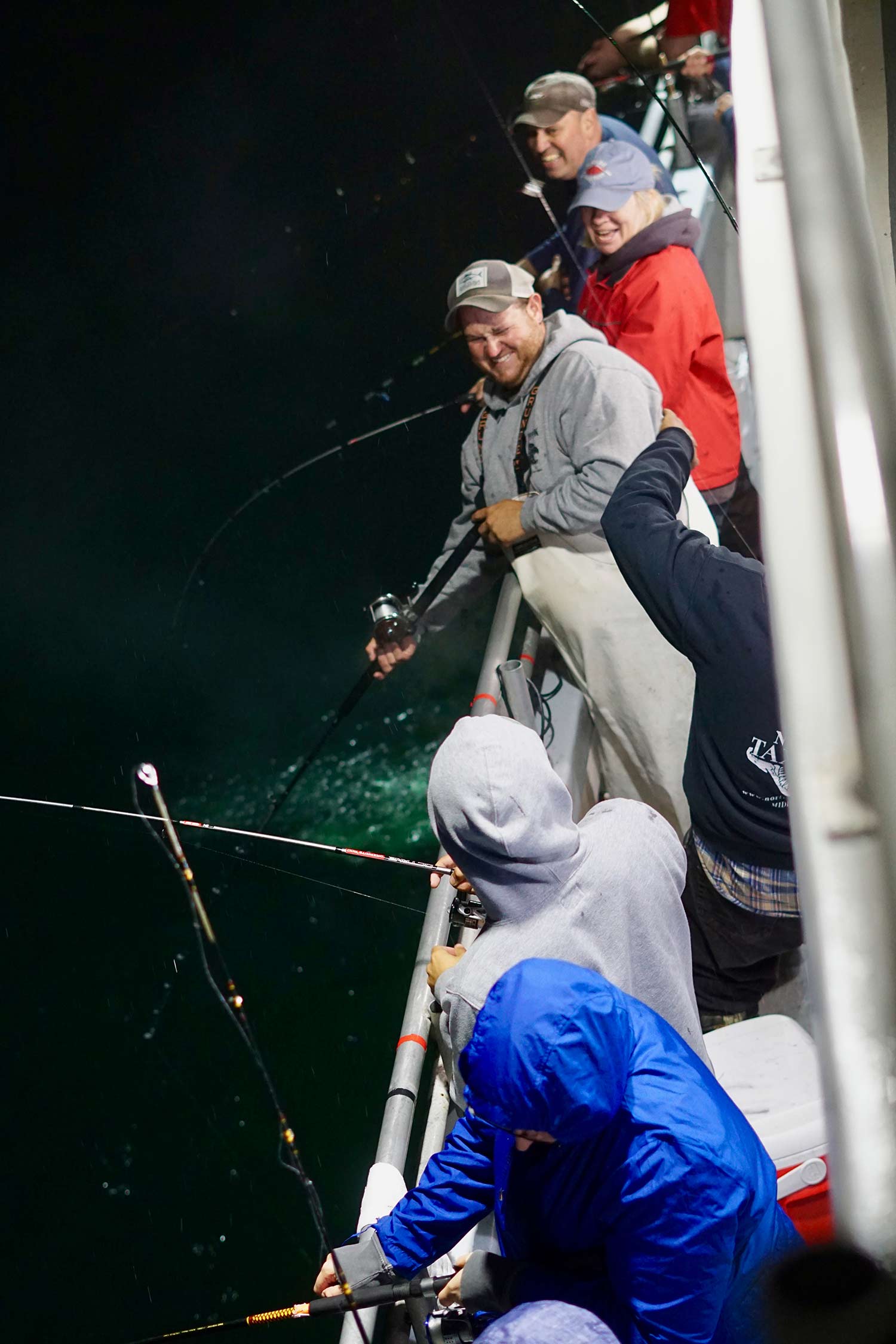 fishermen being sprayed with ink