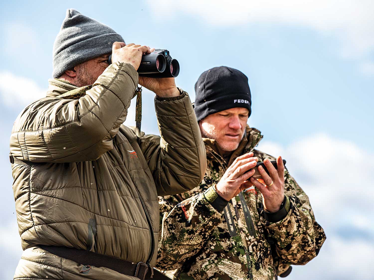 two hunters glassing for moose