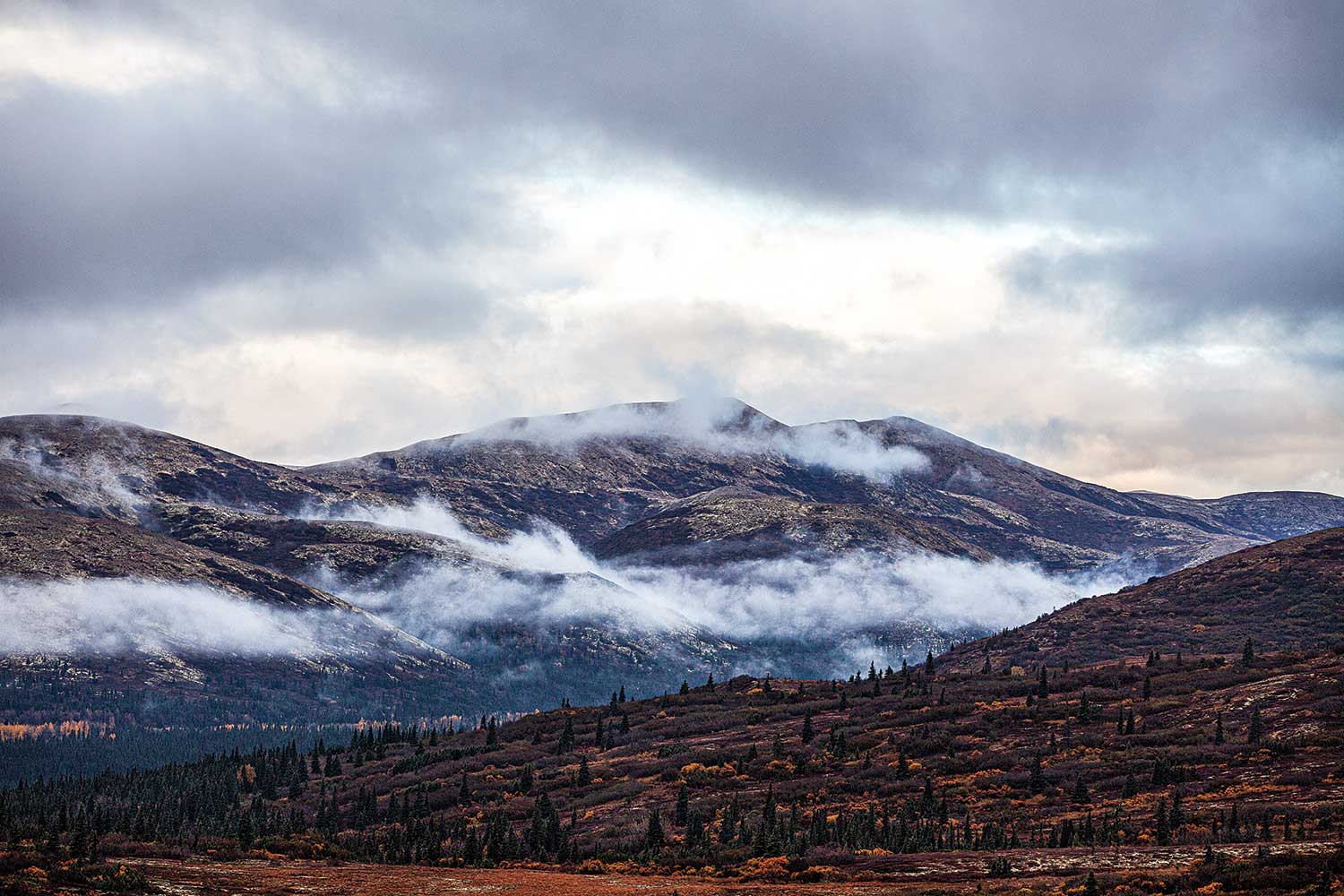 the hillside and mountain ranges of Alaska