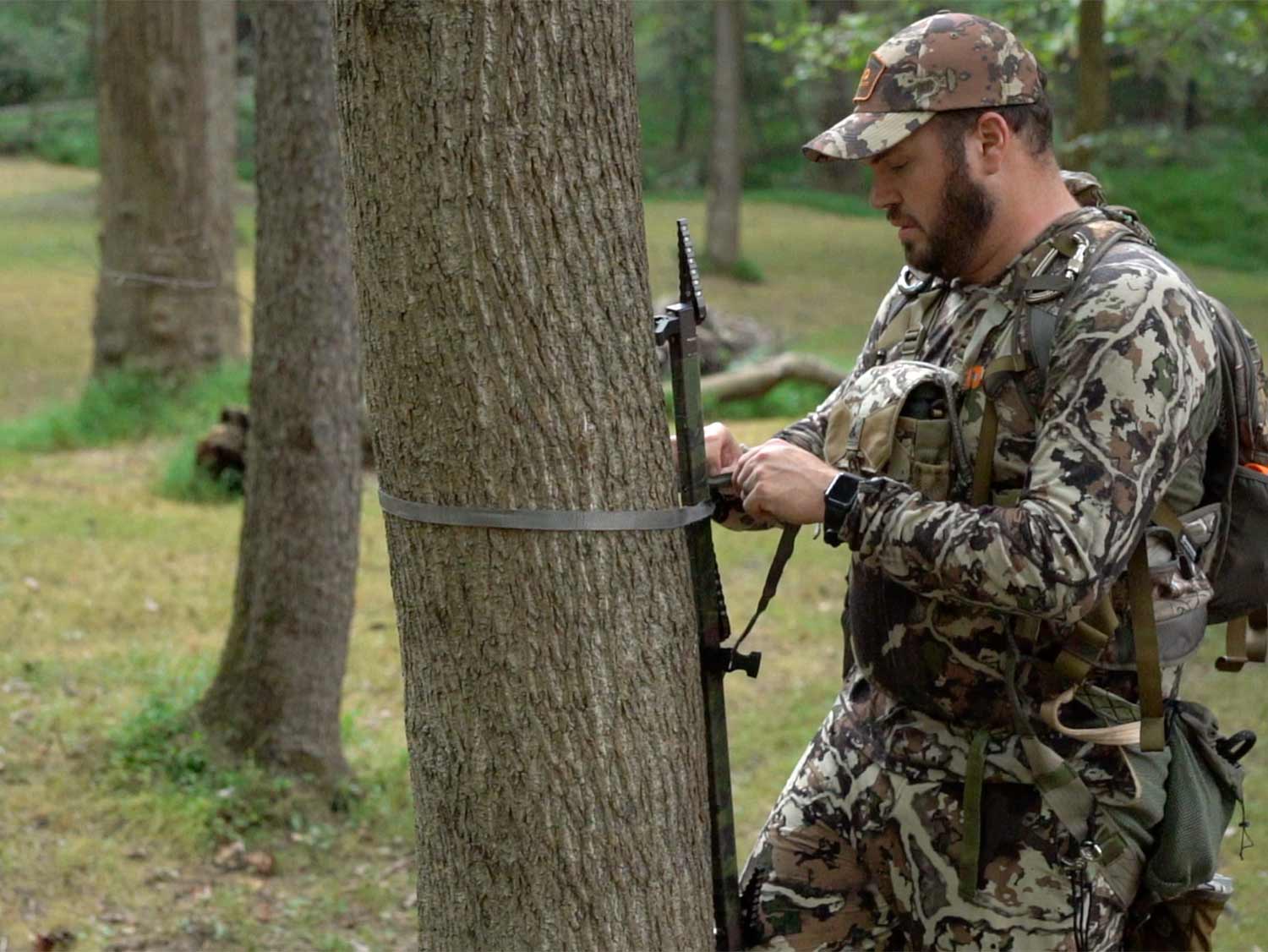 hunter attaching climbing sticks