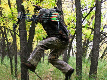 hunter jumping over a deer trail