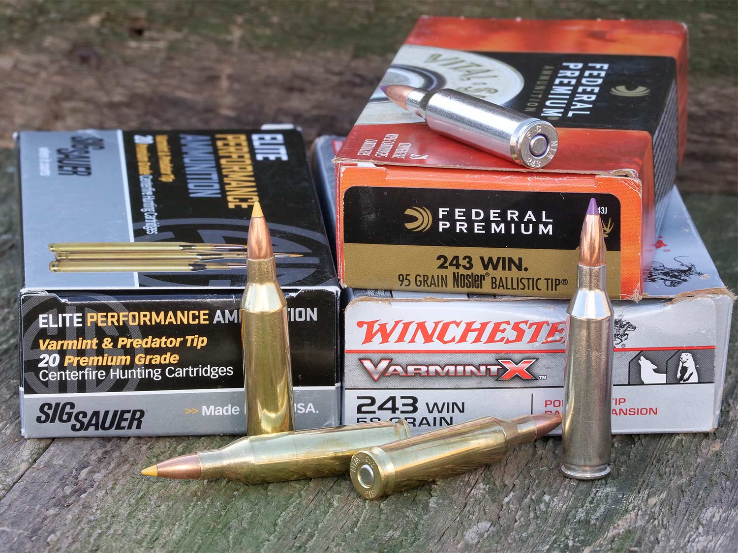 boxes of ammunition on a wooden table