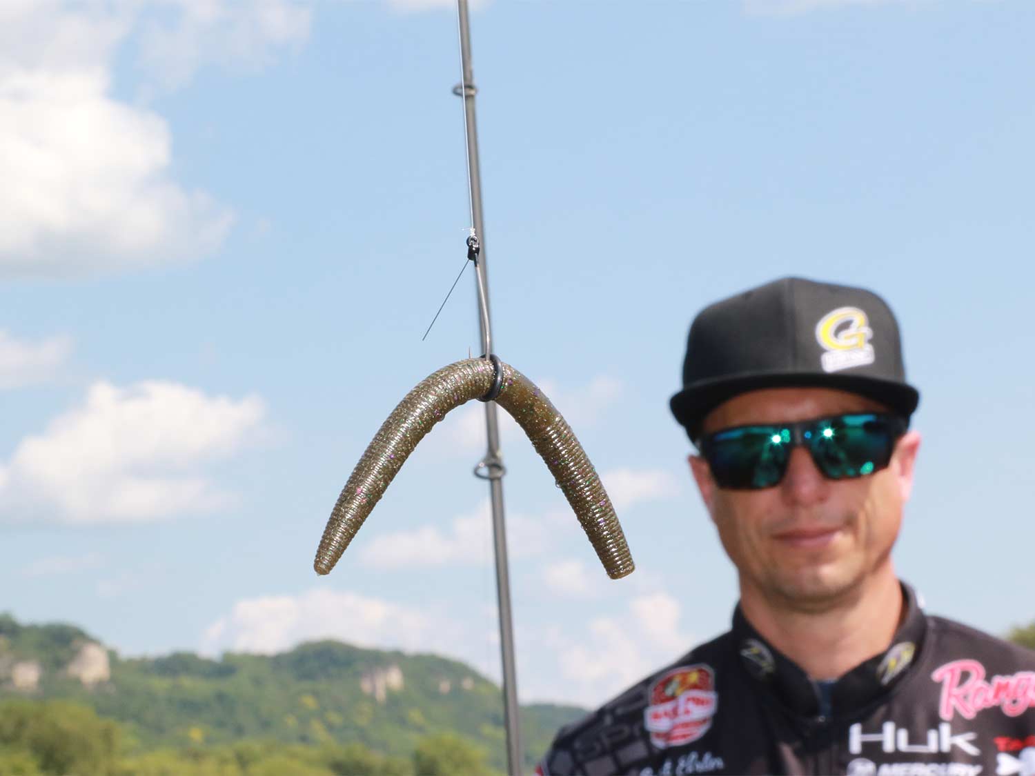 Tournament pro holding up a soft-plastic lure