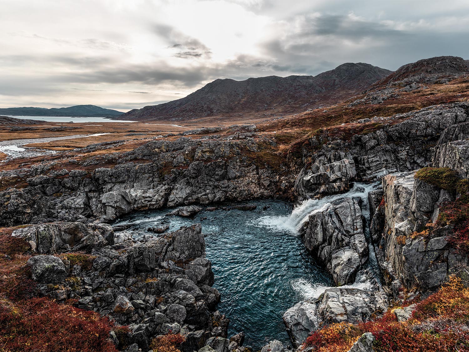 Ice-melt from a glacier pours into a plunge pool before spilling into the North Atlantic.