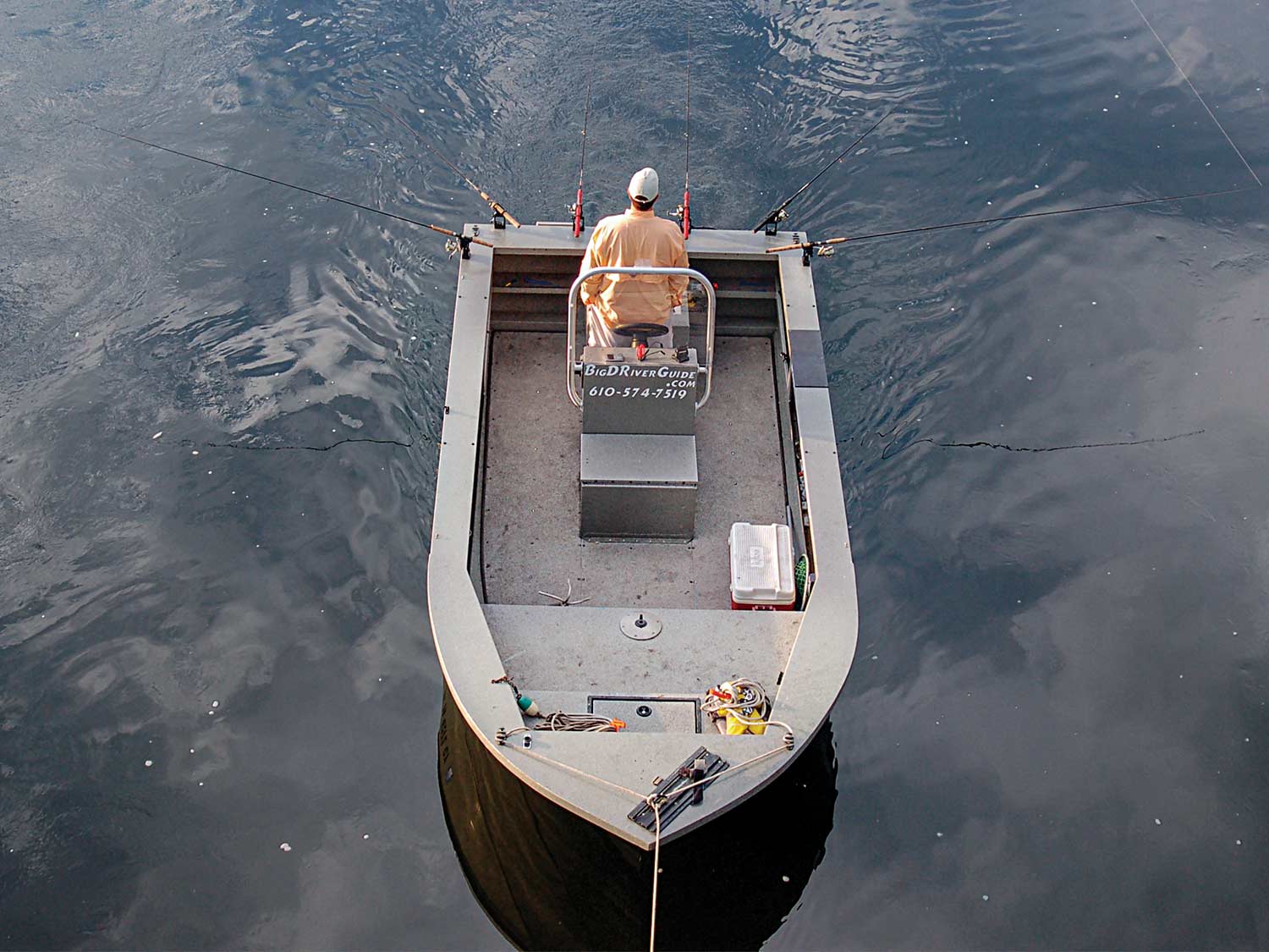 Capt. Dieter Scheel on a boat fishing in the river.