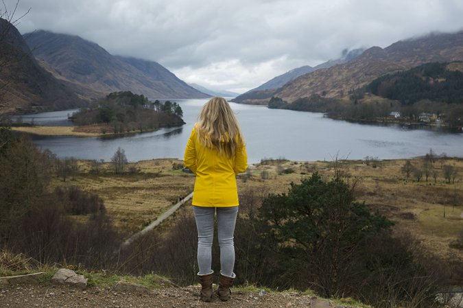 woman in a rain jacket on a mountain