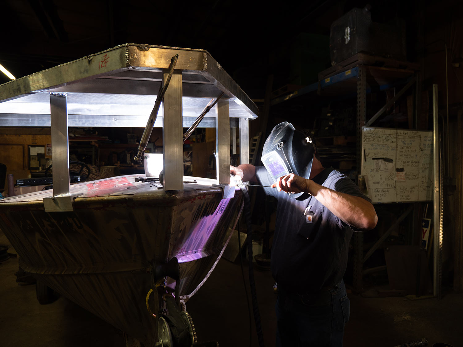 Man constructing a bow deck.