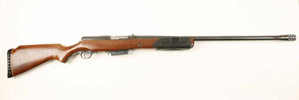 A Mossberg 200K shotgun on a white background.