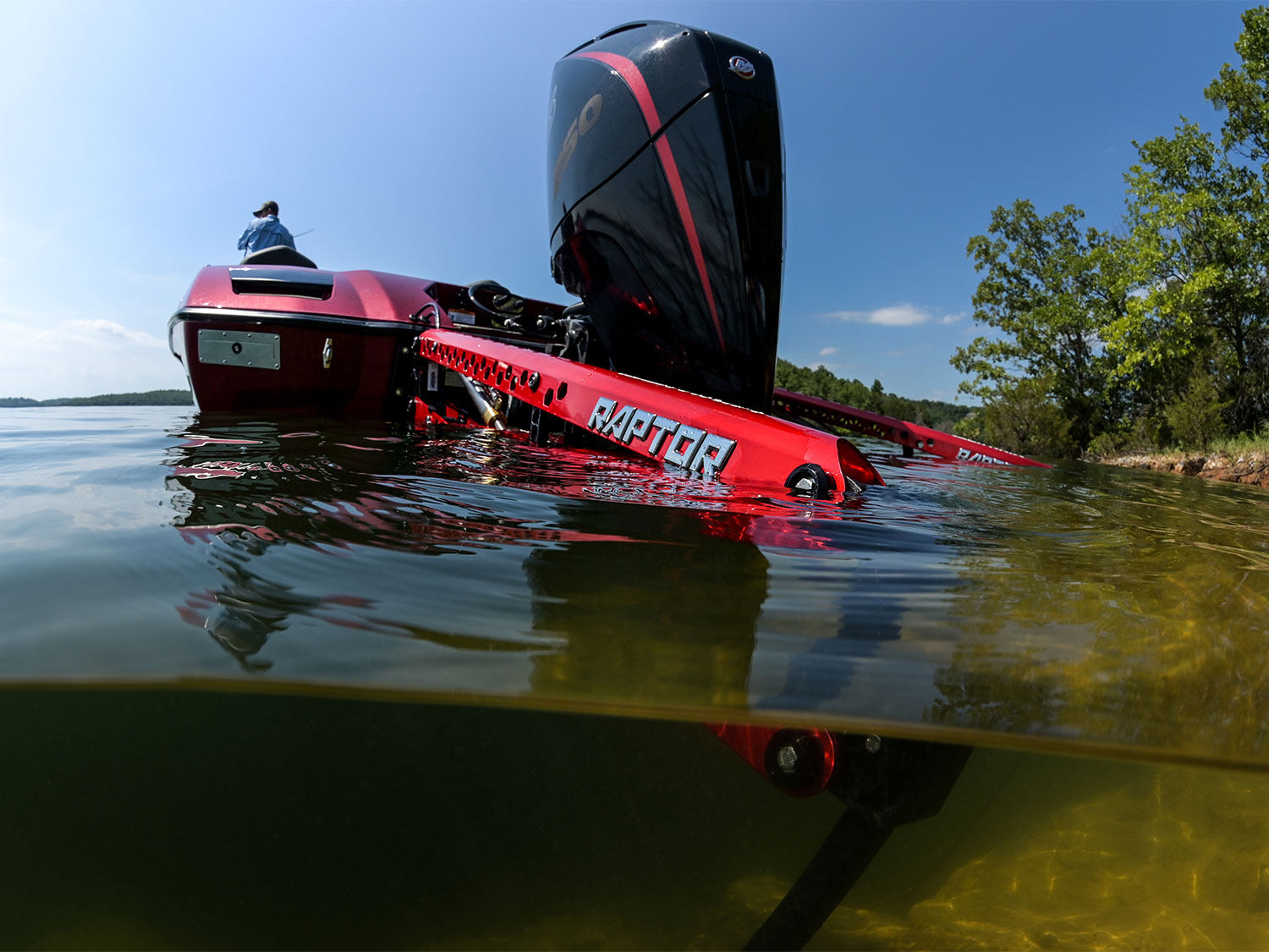 A half-submerged outboard fishing boat motor.