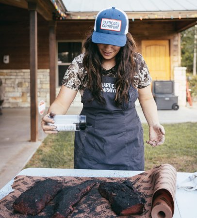 Jess Pryles seasons up elk backstrap.