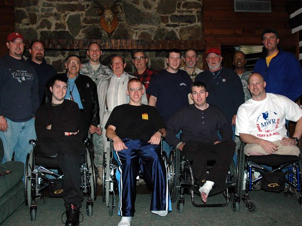 A group of veteran soldiers grouped together for a hunt.