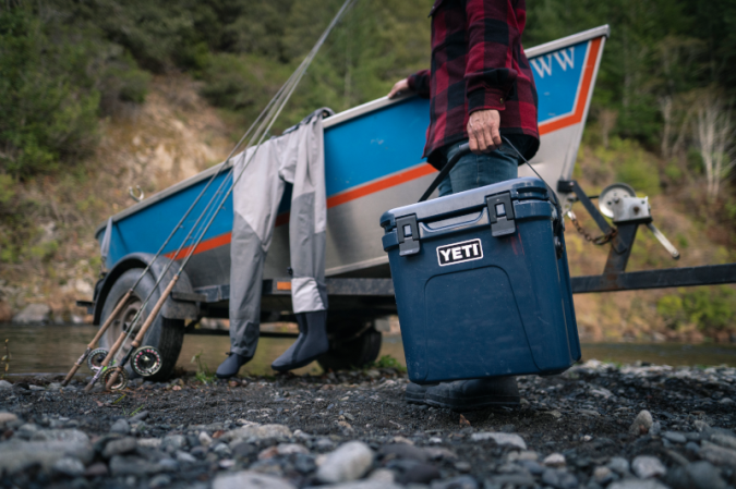 person holding a YETI cooler