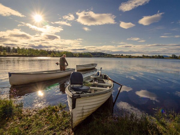 Three fishing boats on the water.