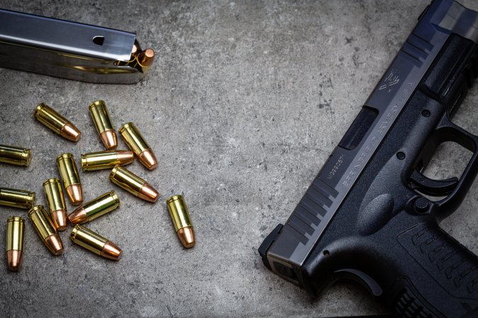 Winchester Defense Ready ammo beside a Springfield Armory handgun.