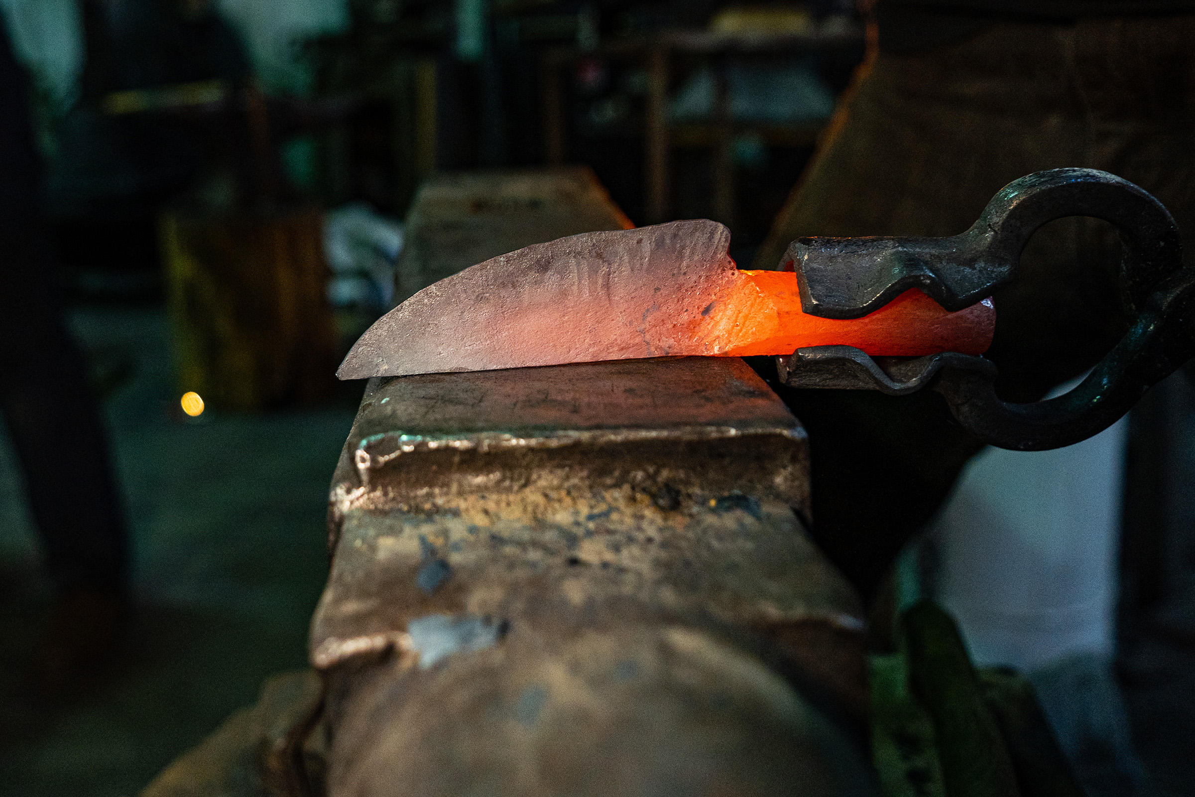 A piece of steel being shaped into a knife.