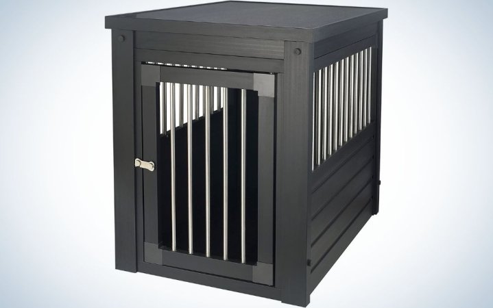  A black wooden house for the dog with limited space made of thin metal spindles.