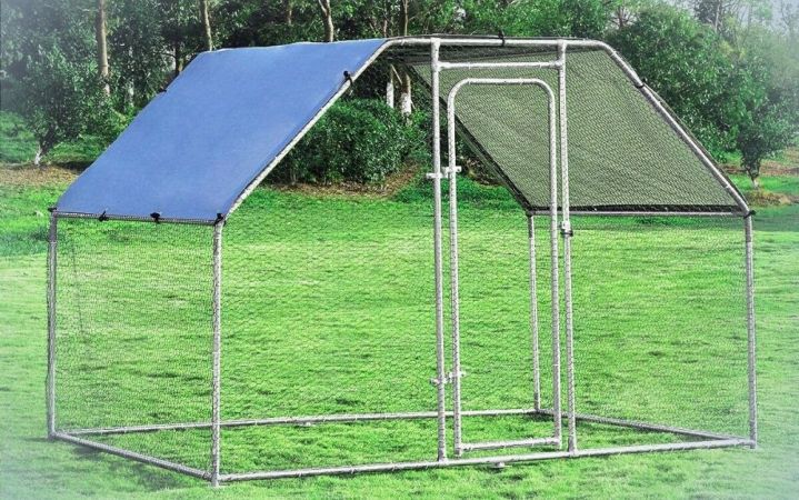  Large walk-in, metal rabbit run with waterproof cover on a backyard