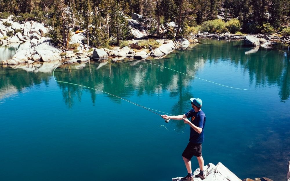 A man casts a fly rod.