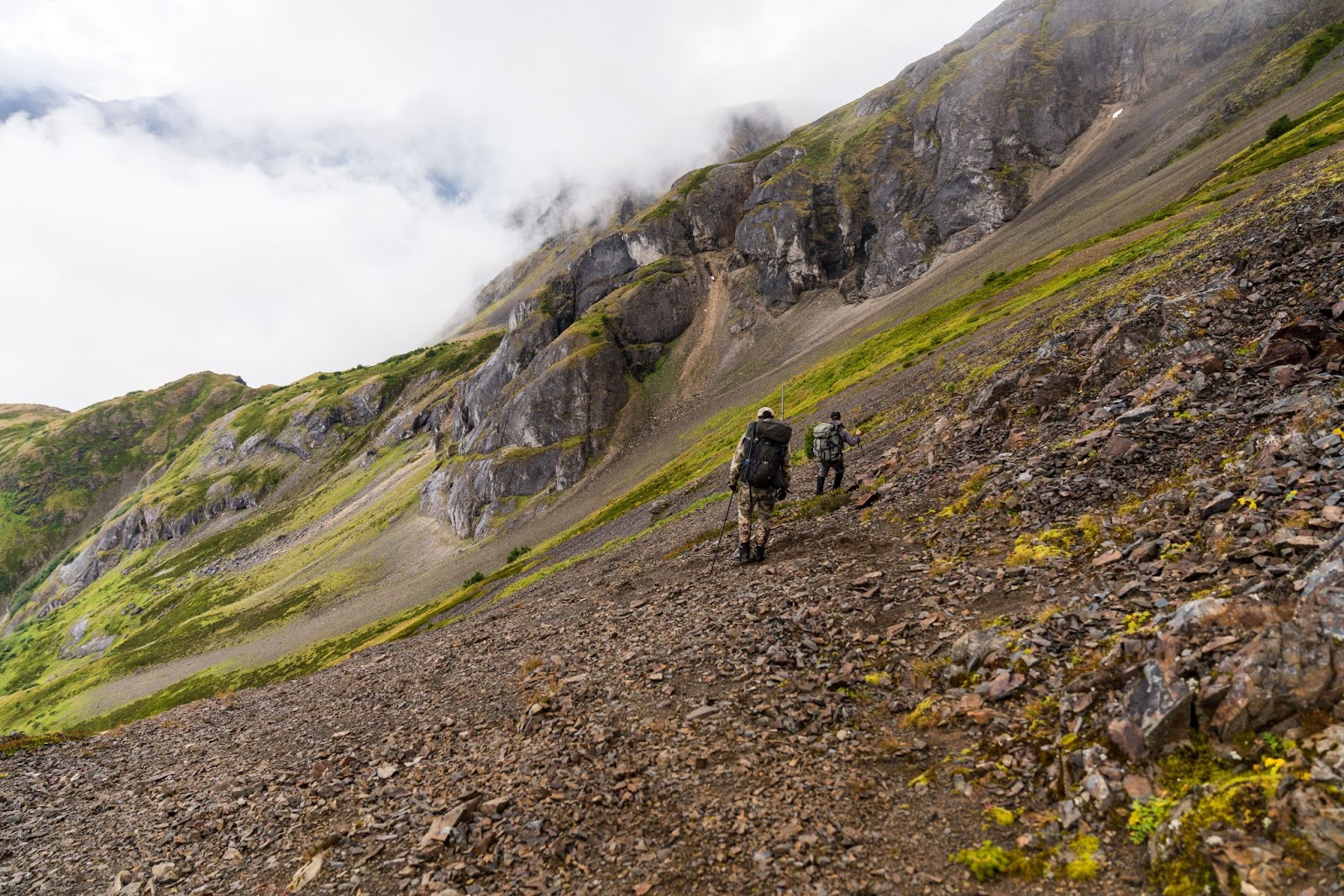 Hiking with backpacking tent while mountain goat hunting.