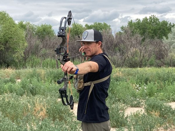 guy shooting bow