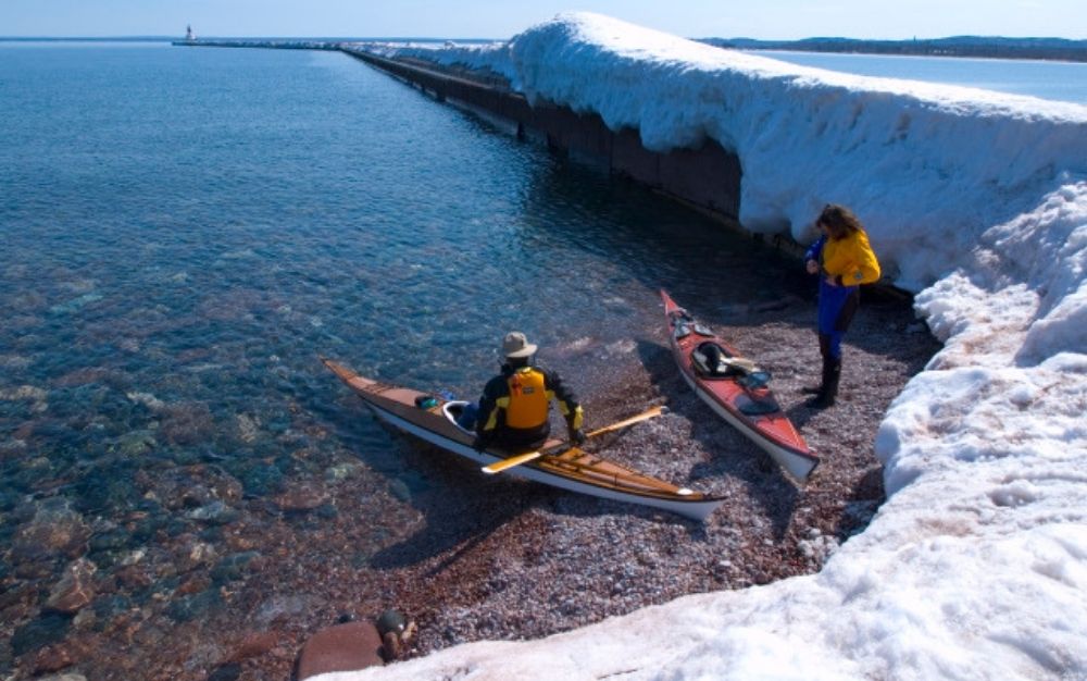 Kayakers wearing dry suits.