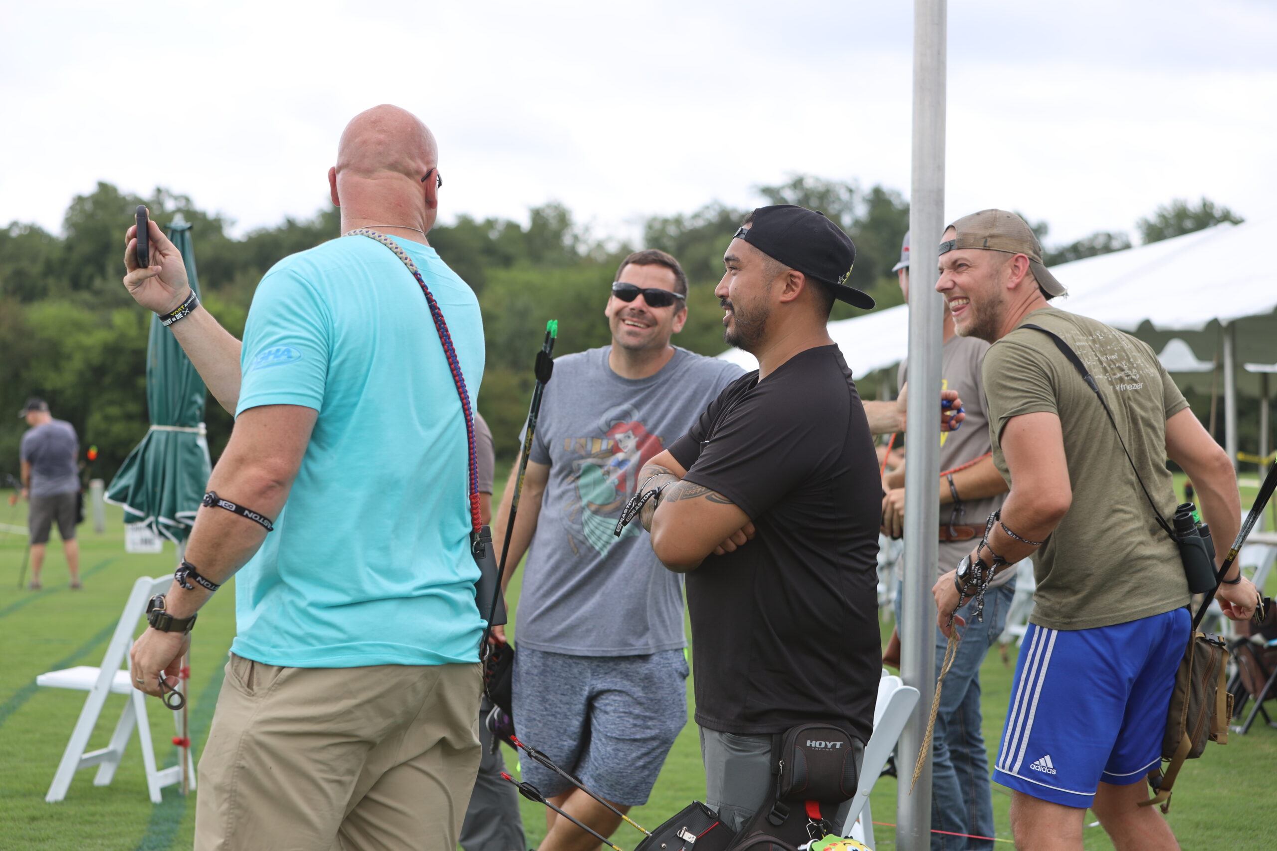 Barebow archers having fun between ends of shooting