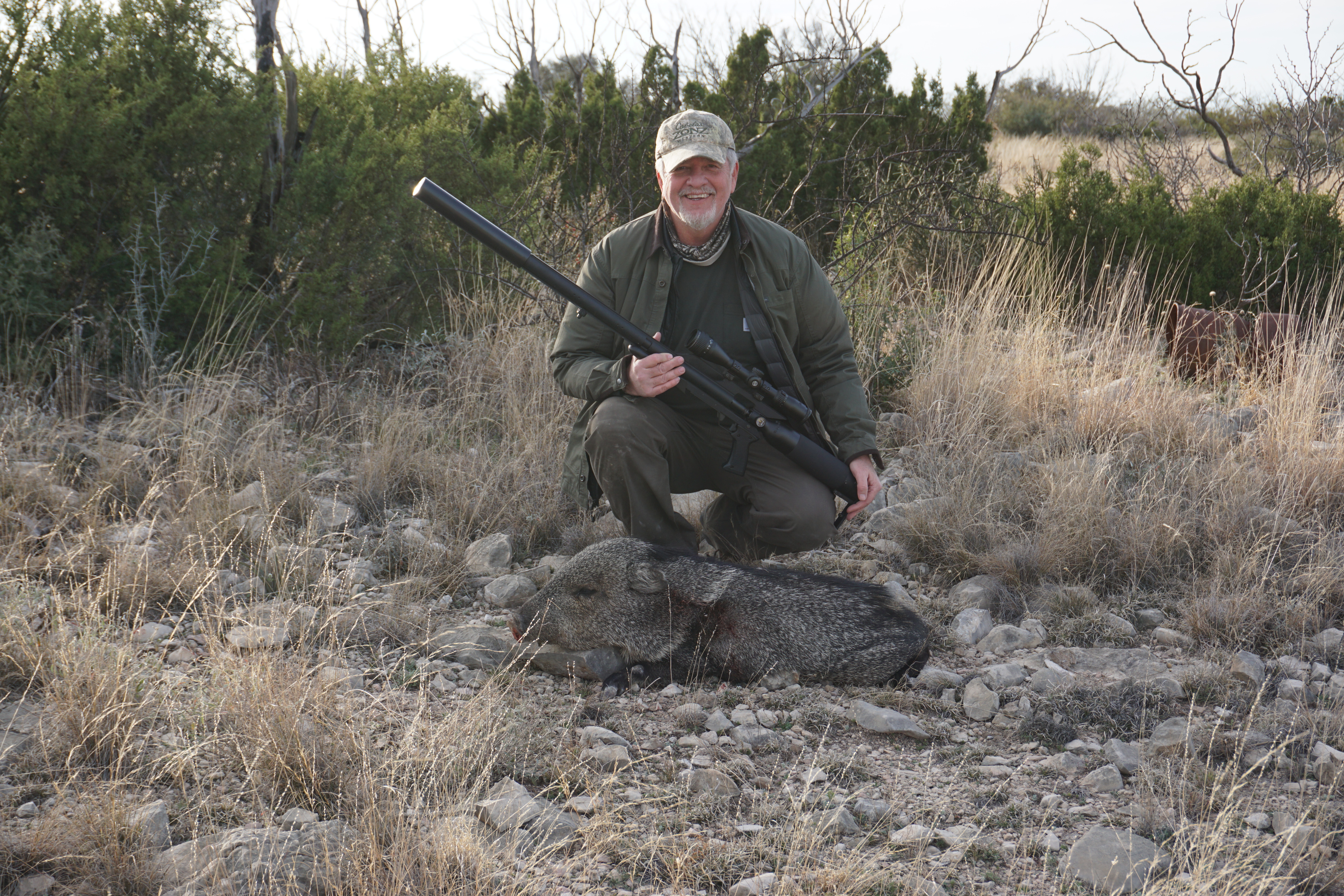 The author with a Javelina taken with the AIrForce Texan big bore.