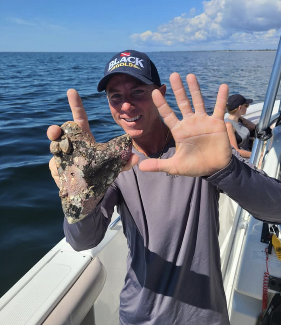 The prehistoric shark tooth was found by the captain and experienced aquatic fossil hunter on Oct. 15