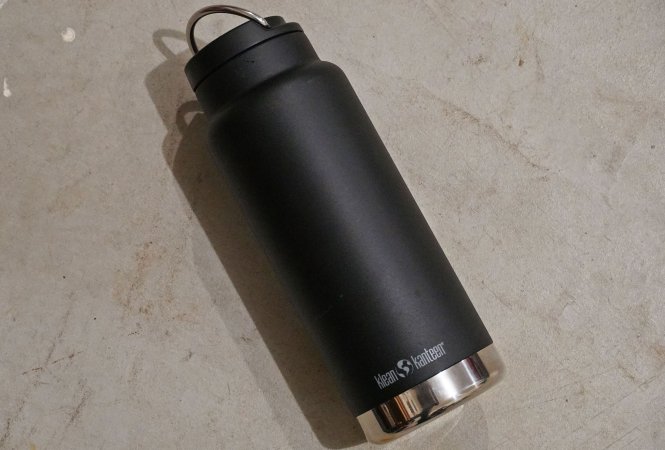  A black Klean Kanteen thermos with a black cap