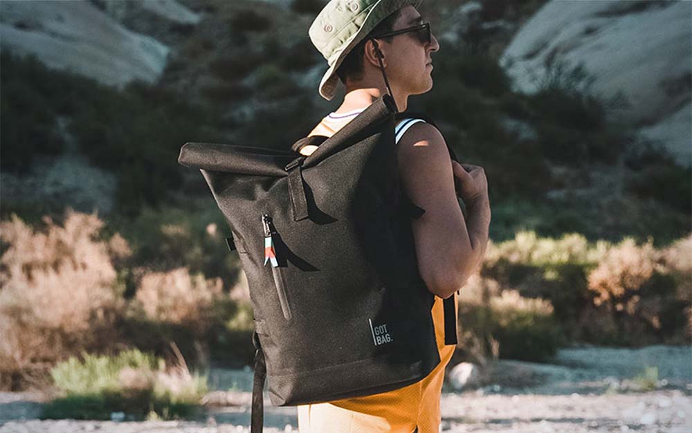 A man wearing a black backpack