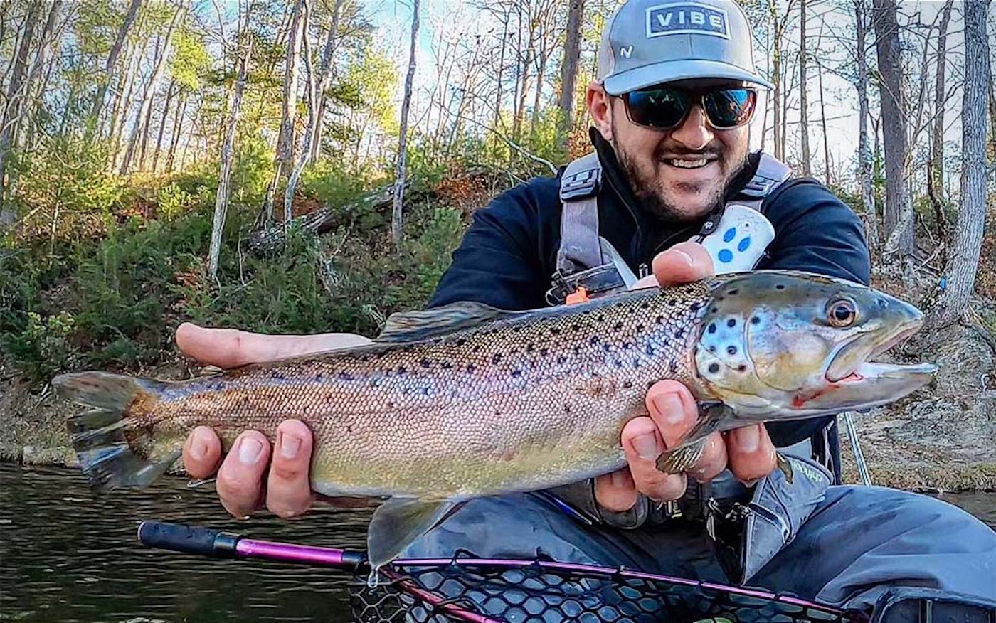 A man holding a large trout