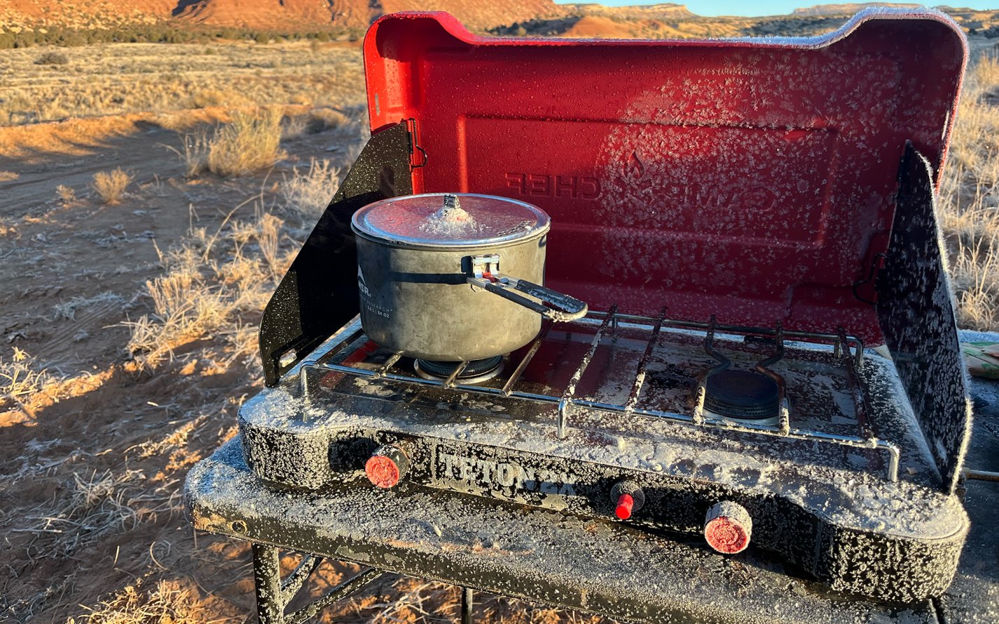 A camp stove thaws from an overnight freeze.