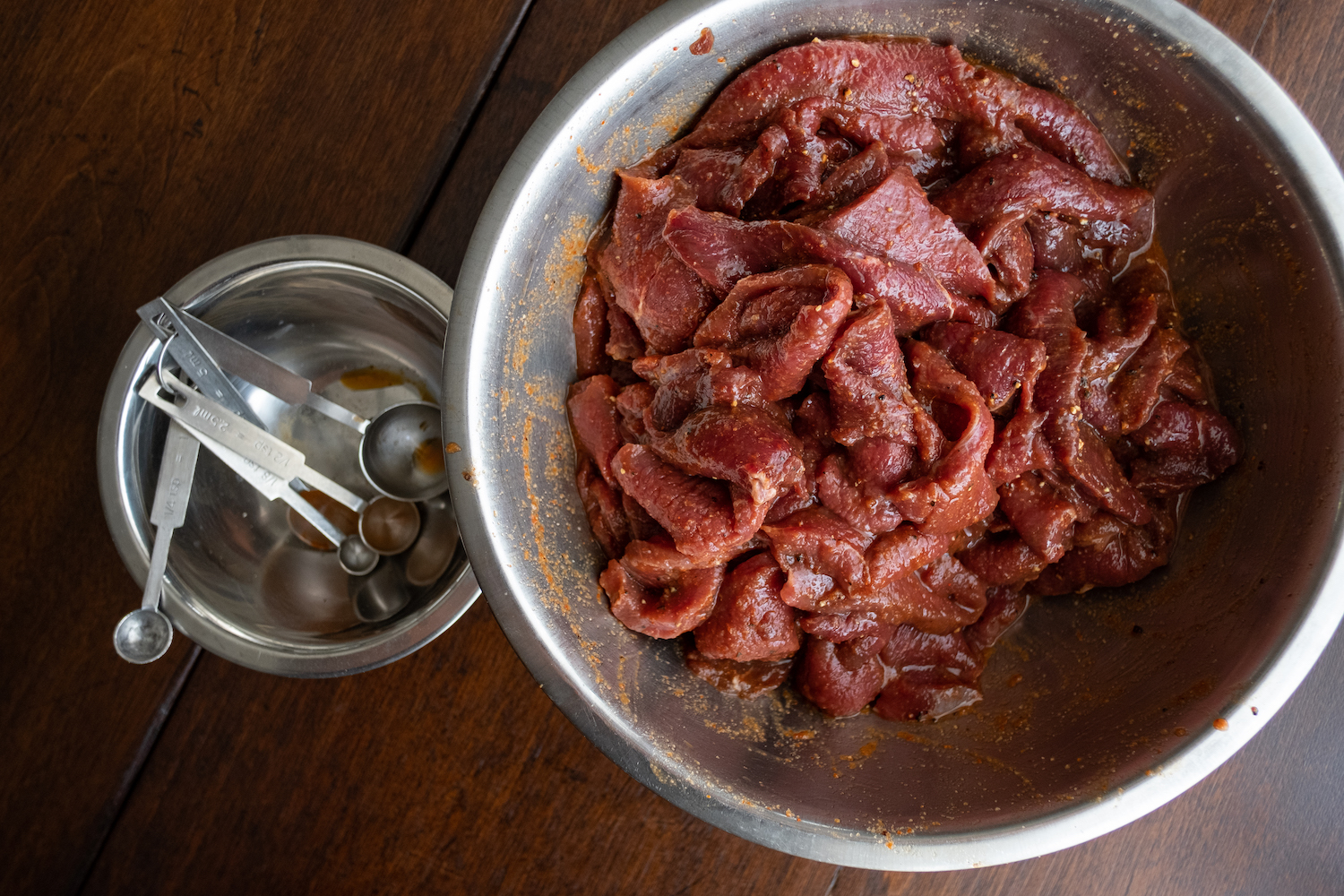 A bowl of seasoned meat slices