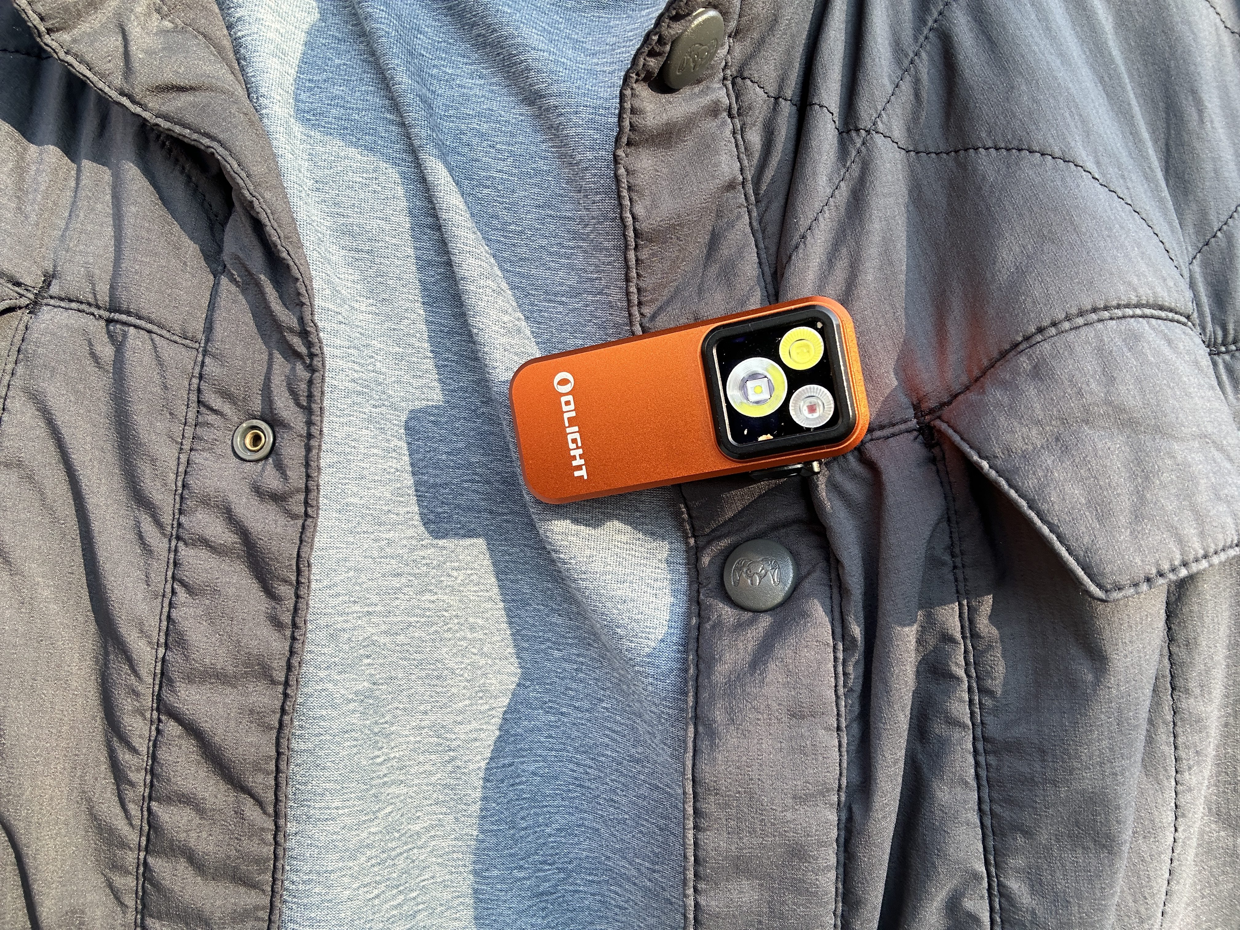 The Olight Clip Pro attaches to shirts and anything else via a clip or magnet. 