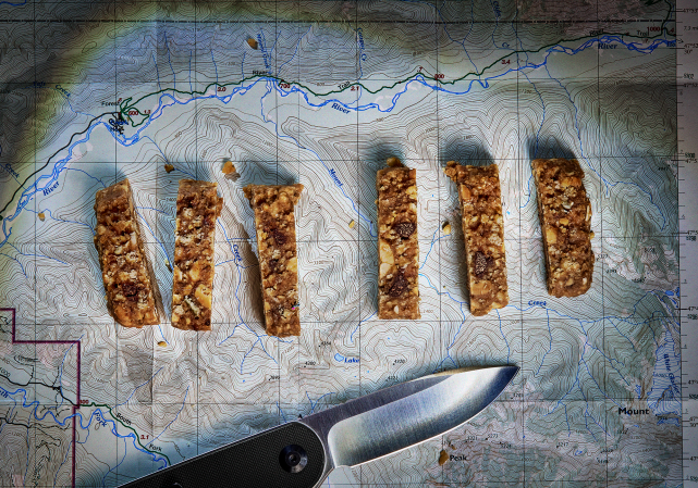 Granola bar cut up on an Alaska map of Dall sheep country