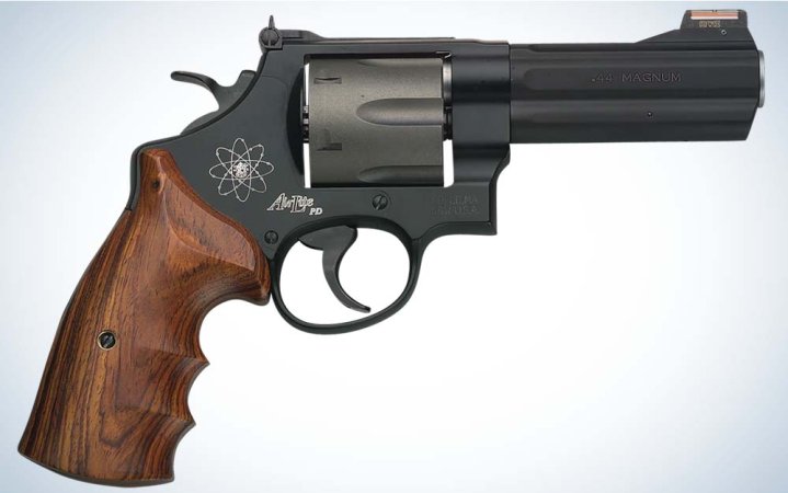  A black revolver with a wooden handle