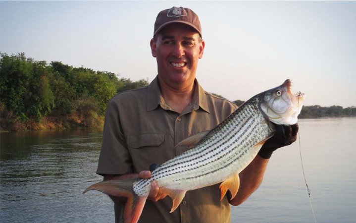 The author with a tiger fish caught on the Daiwa ardito.