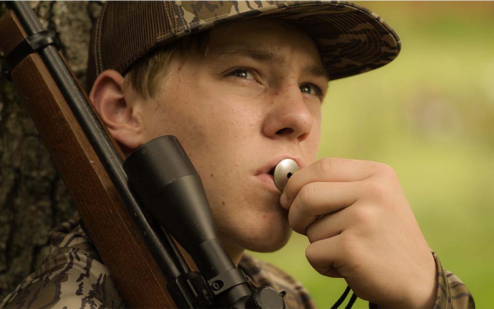 Hunter with Squirrel Whistle The Best Squirrel Calls of 2024