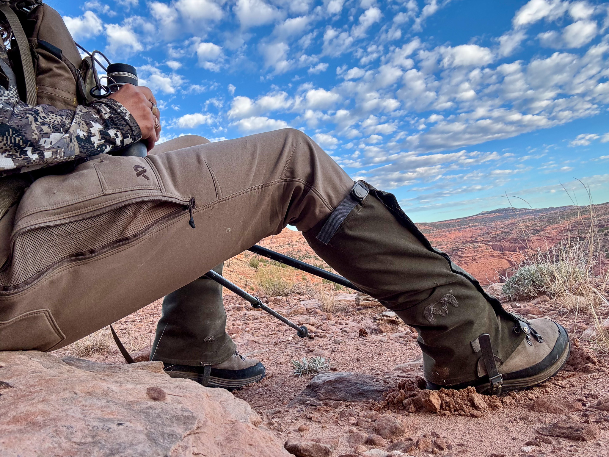 A hunter wearing women's hunting pants made by First Lite sits for a quick glassing break.