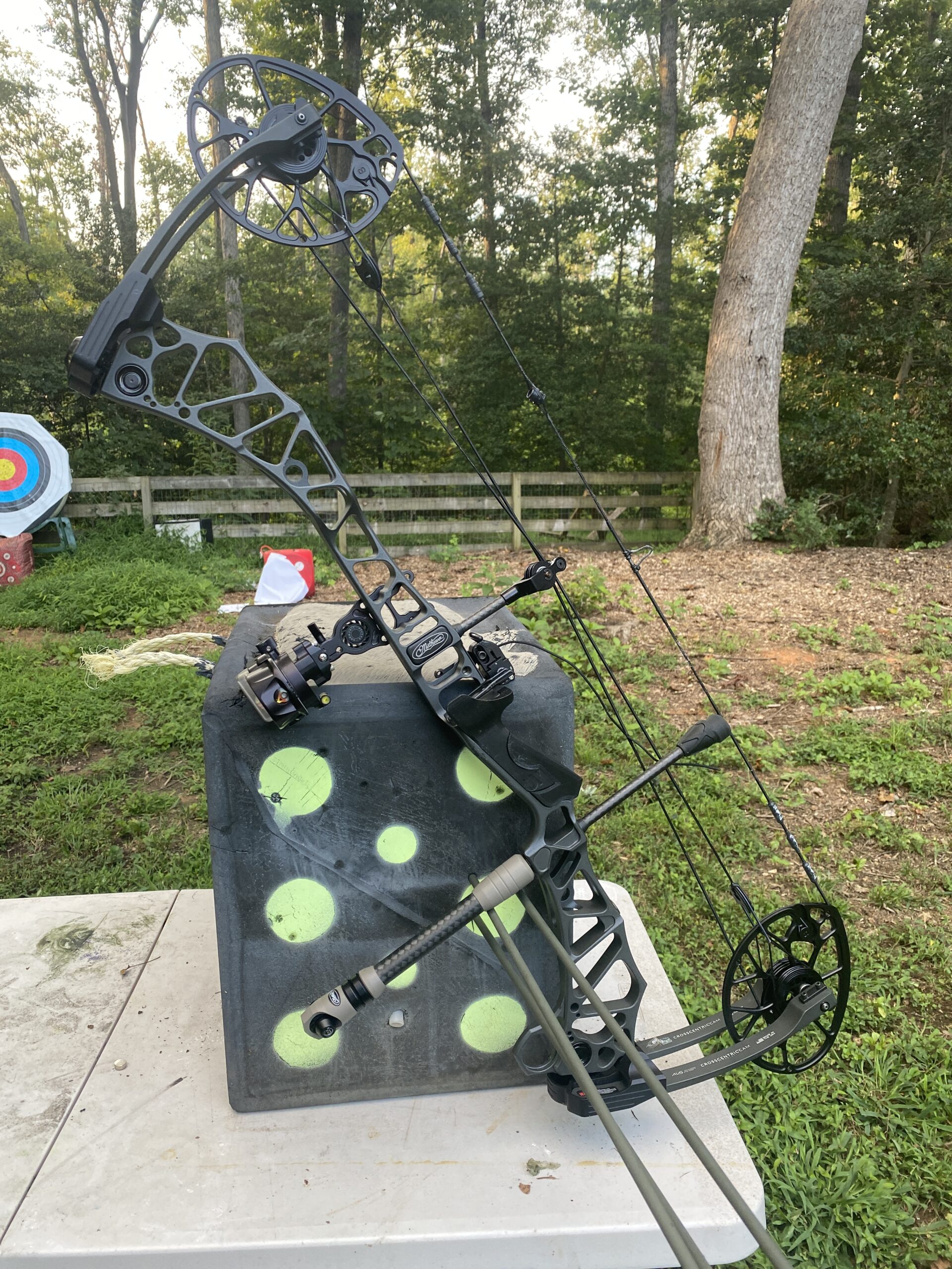 Bow used for accuracy testing leaning on target.