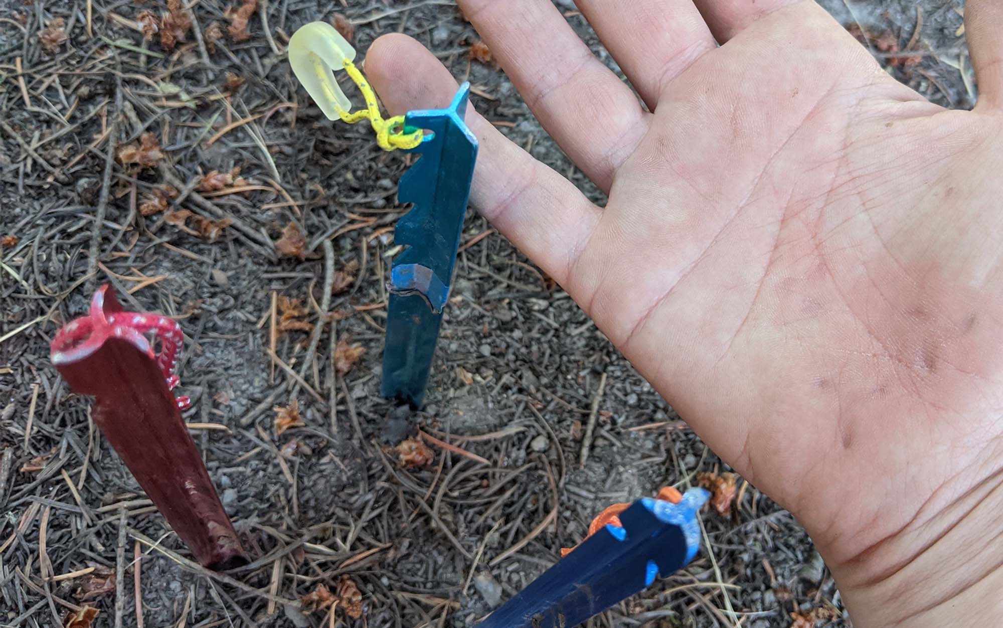 Y-shaped tent stakes have excellent staying power, but are pretty uncomfortable to press into the ground with your hand.