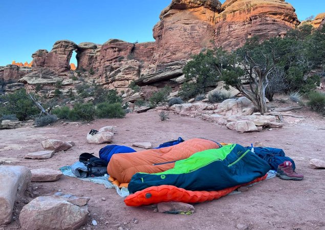 Author using an inflatable sleeping pad to cowboy camp.